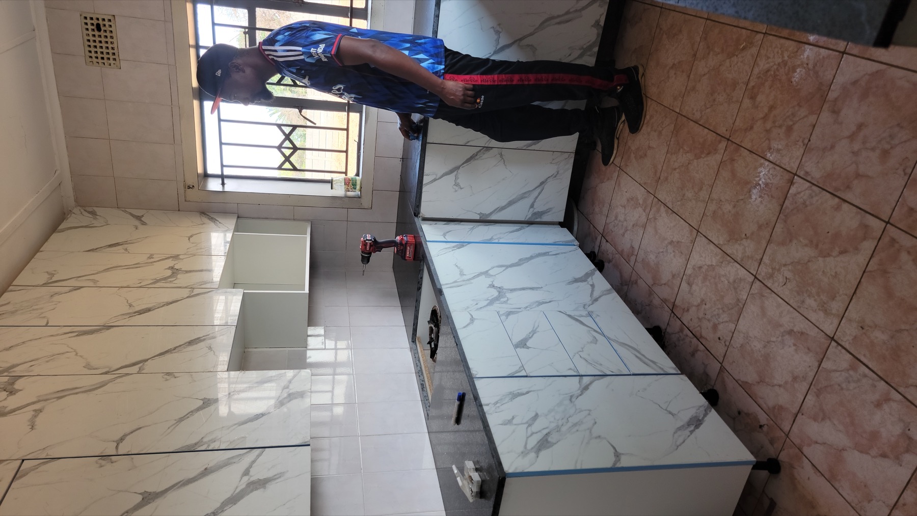 Full view of fitted kitchen during installation