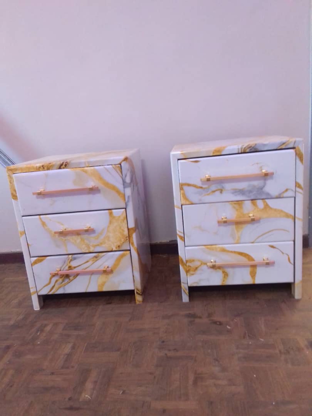 Pair of fitted bedside cabinets with brass handles