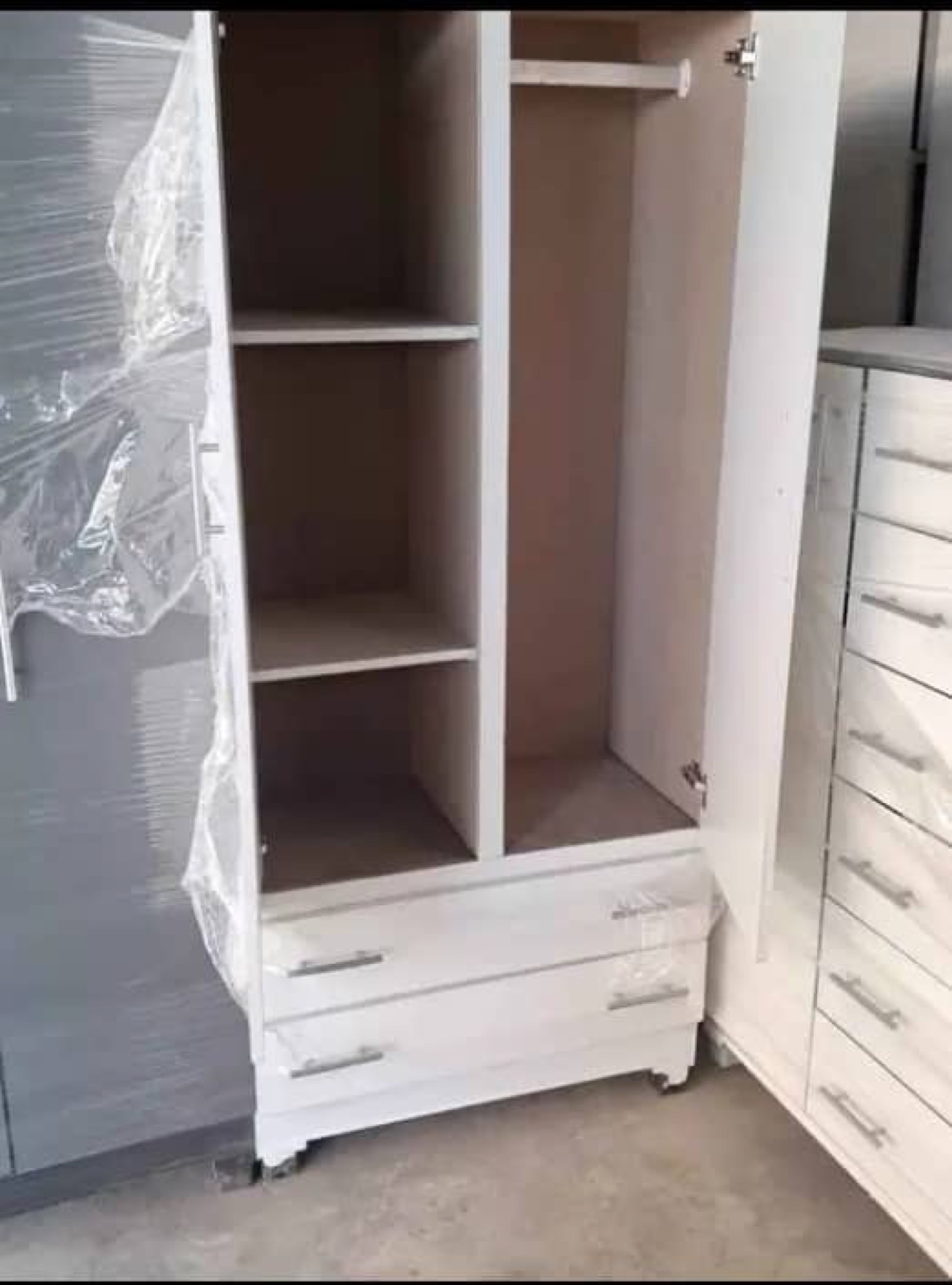 Organised fitted wardrobe with rails and drawers
